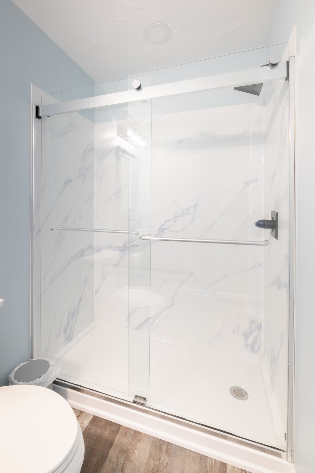Frameless glass & marble shower